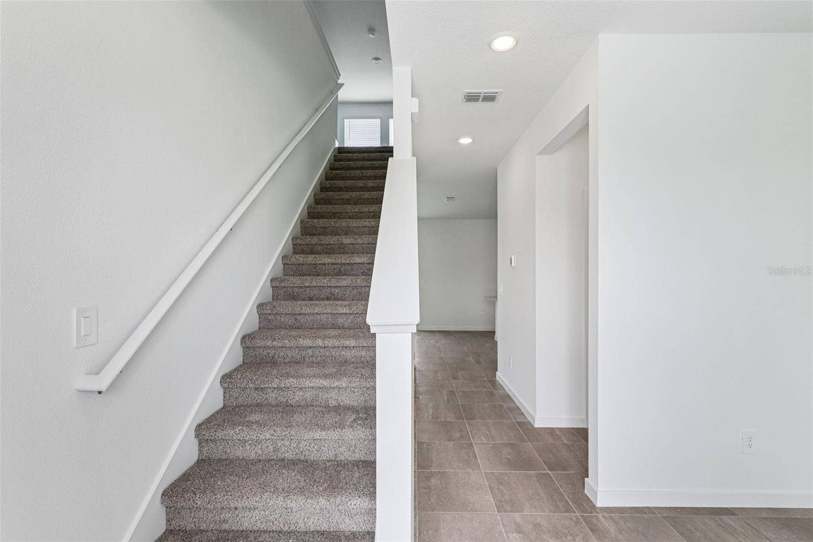 The interior photos are of another home with the same floor plan but different interior color package finishes. Some details may vary
