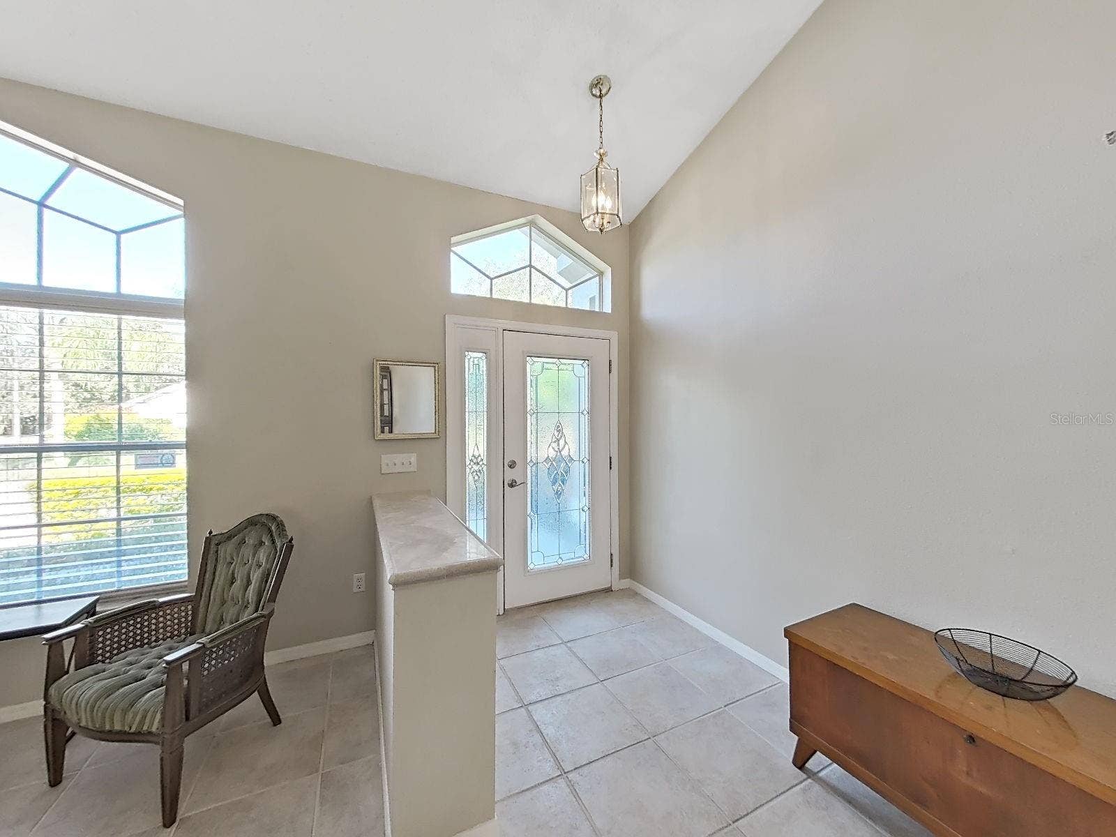 15001 MEADOWLAKE STREET, Odessa, FL 33556 leaded glass front door with side light and fan light, cathedral ceilings