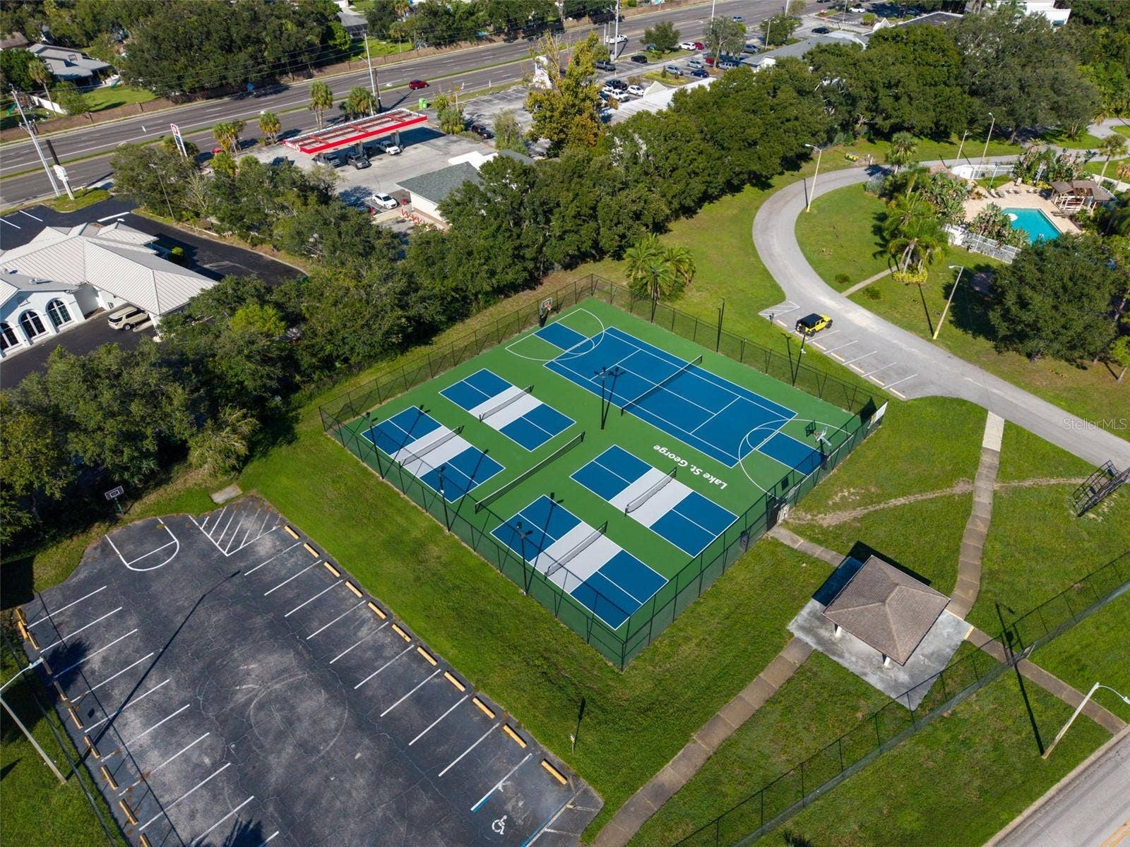 3992 ORCHARD HILL CIRCLE, Palm Harbor, FL 34684 Lake St. George Community swimming pool, tennis courts, basketball courts, and a playground