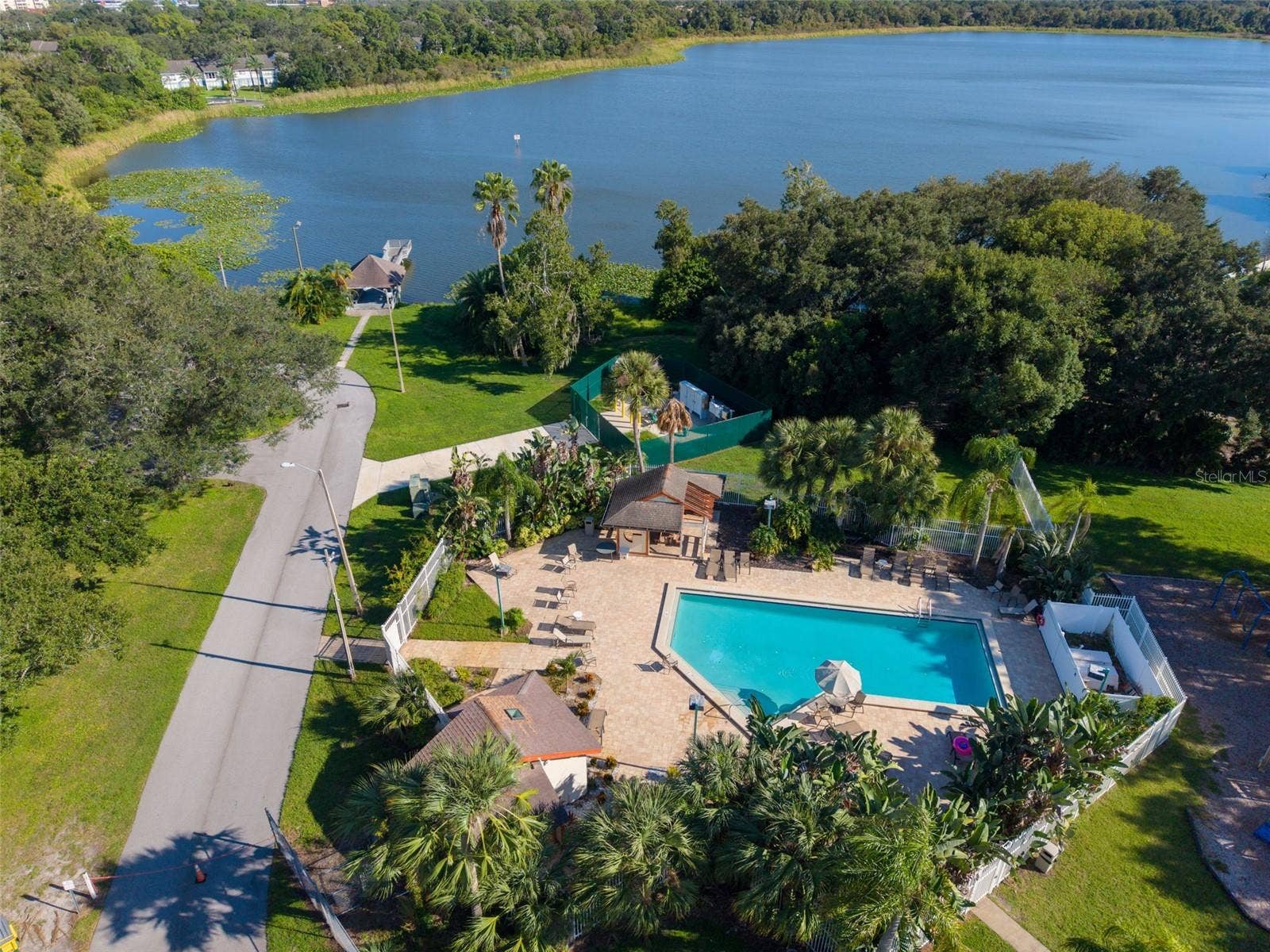 3992 ORCHARD HILL CIRCLE, Palm Harbor, FL 34684 Lake St George Community swimming pool, tennis courts, basketball courts, playground, water access and dock.