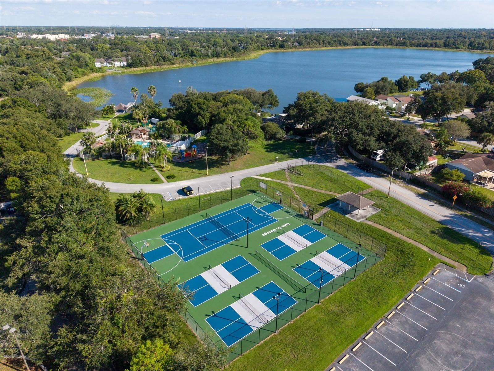 3992 ORCHARD HILL CIRCLE, Palm Harbor, FL 34684 Lake St George Community swimming pool, tennis courts, basketball courts, playground, water access and dock.