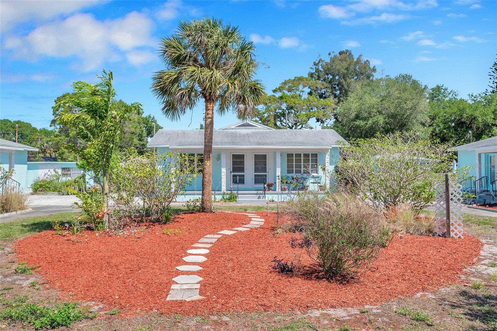 5025 28TH AVENUE S, Gulfport, FL 33707 Garden path through the landscaped front yard at 5027