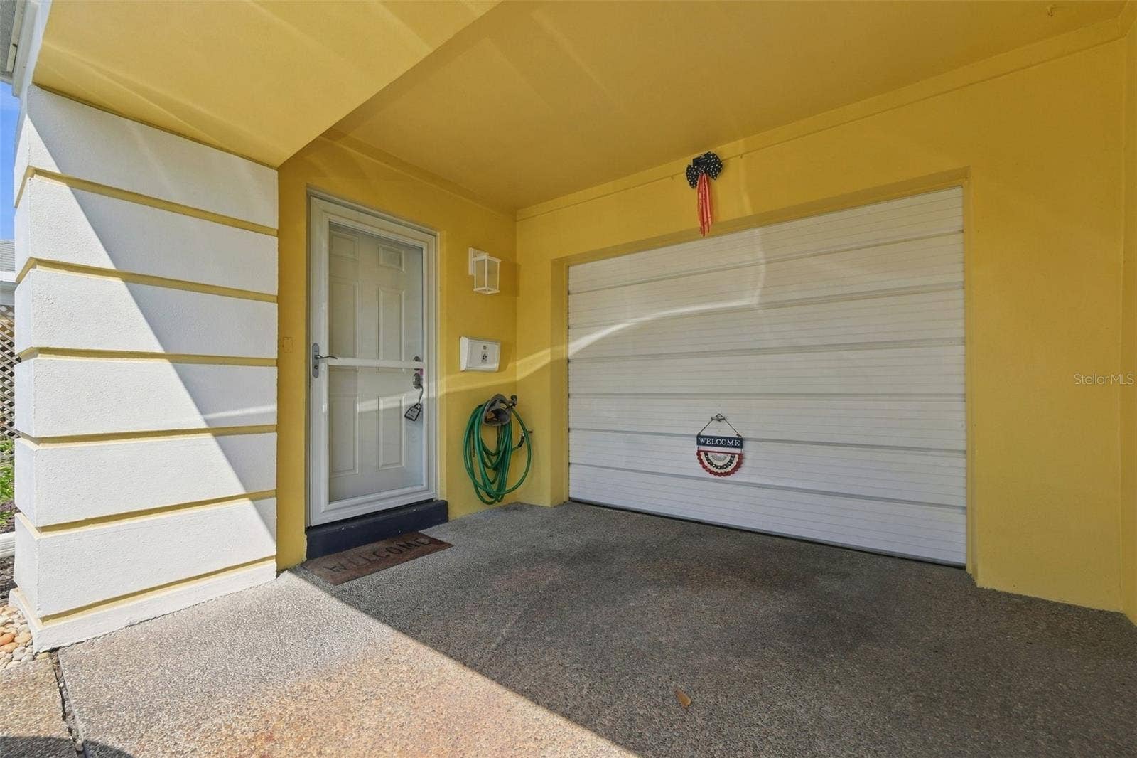 8353 CANDLEWOOD ROAD, Seminole, FL 33777 Entrance and Attached Garage