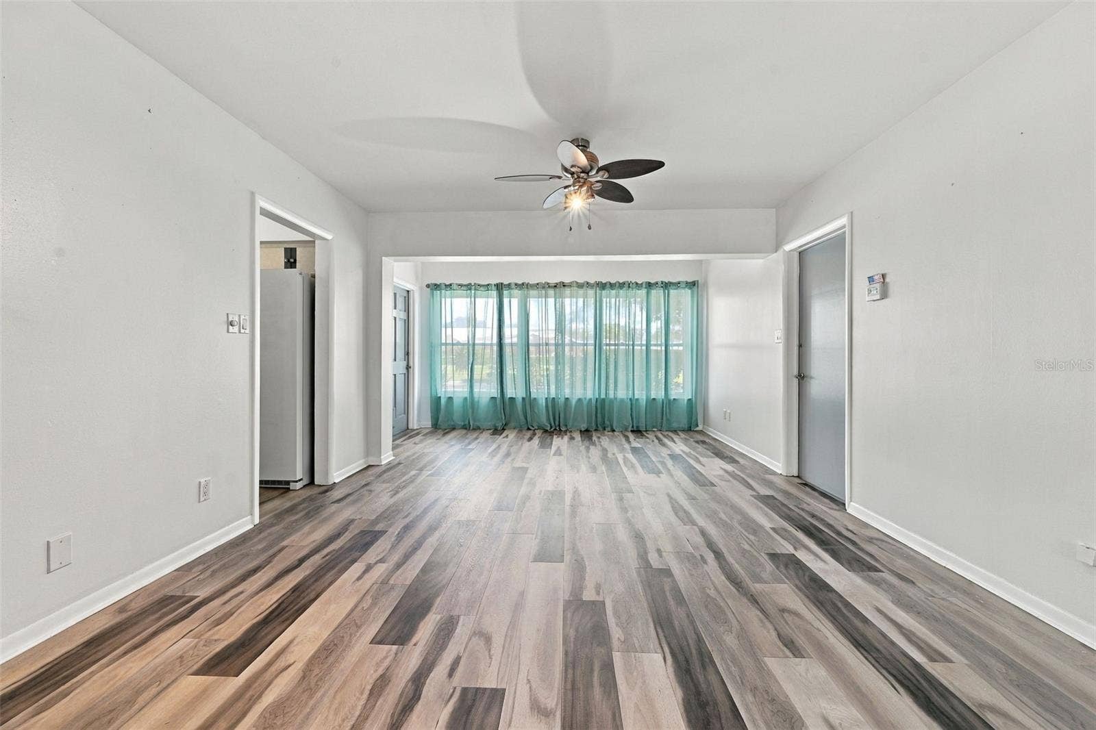 8353 CANDLEWOOD ROAD, Seminole, FL 33777 Spacious Living Room & Dining Room Area