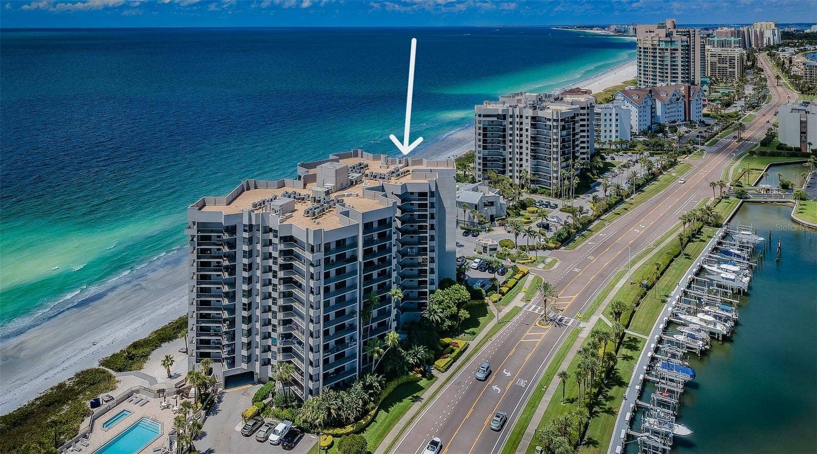 Uninterrupted Waterfront Horizons. Unmatched Sand Key Living!