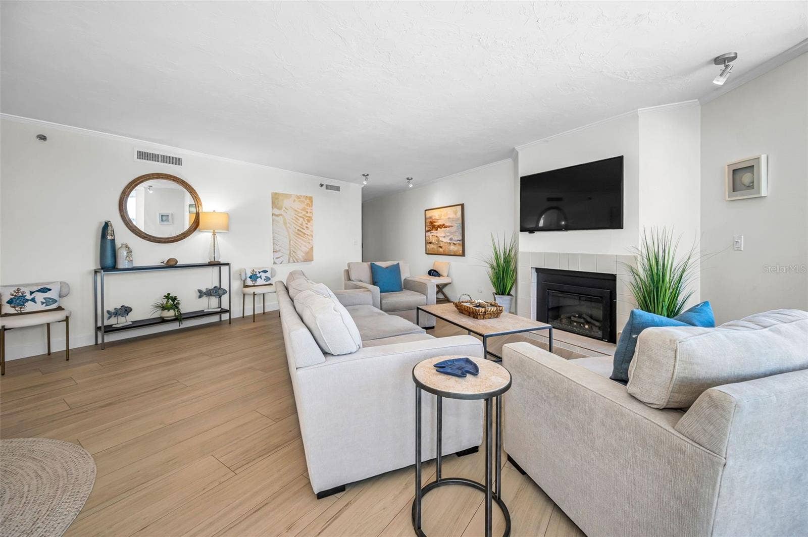 The Living Room / Grand Salon with a fireplace as its anchor