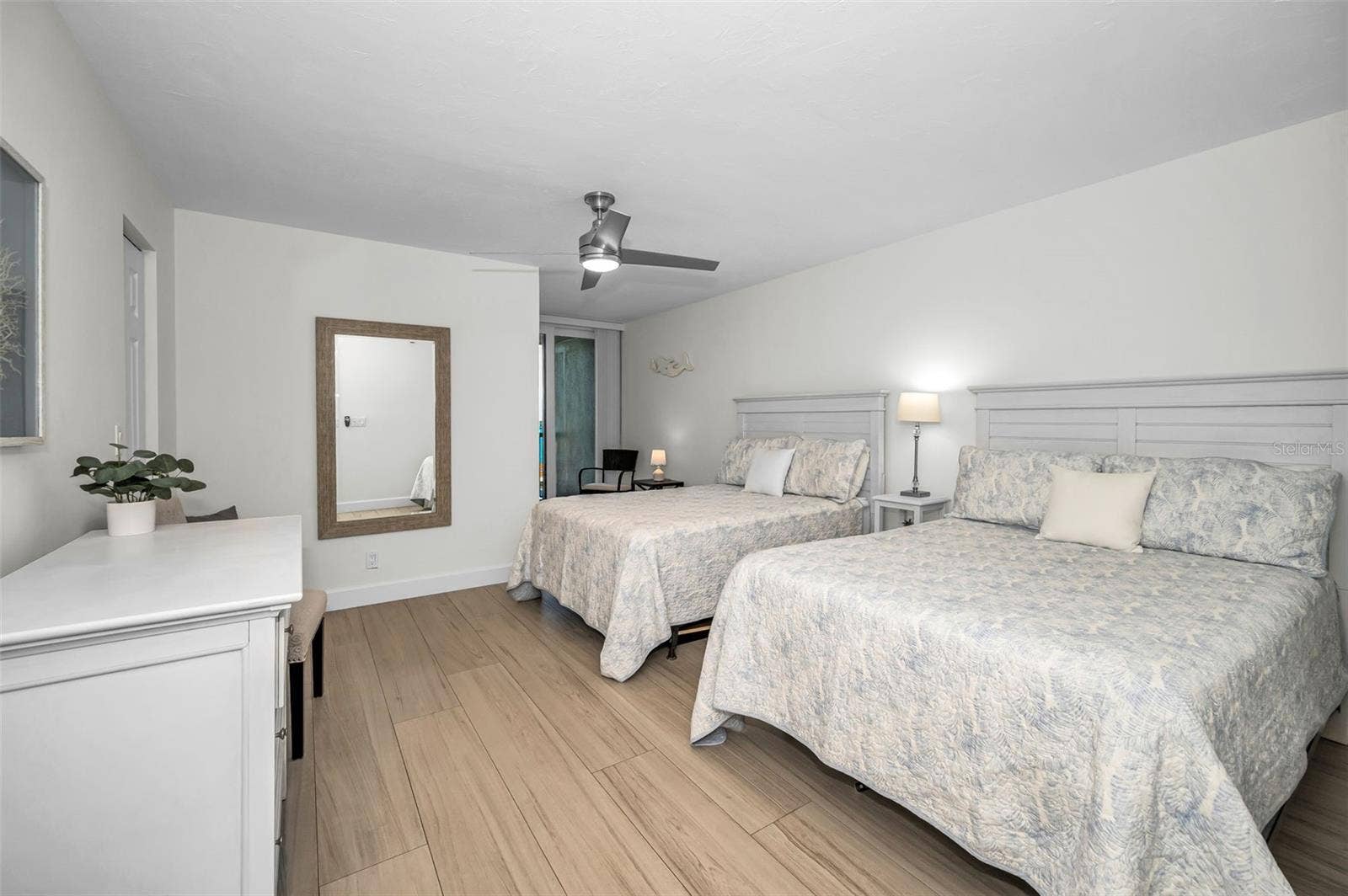 Privately situated second bedroom tucked on the opposite wing