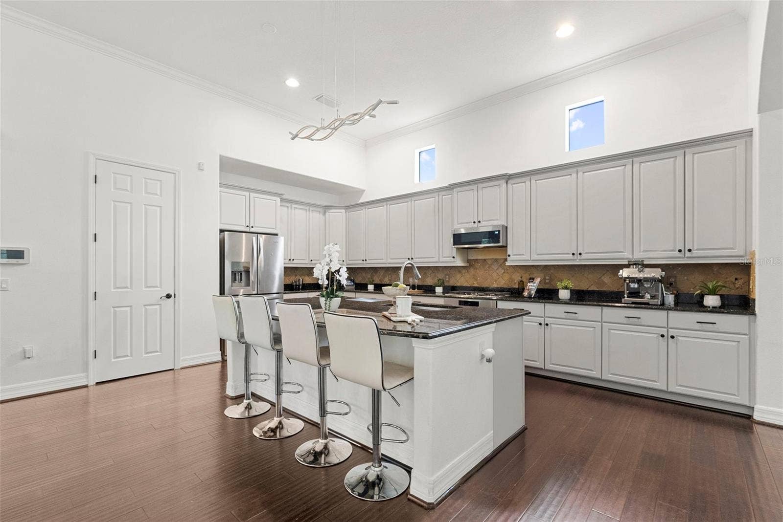 Kitchen-Expansive Island With Bar Seating