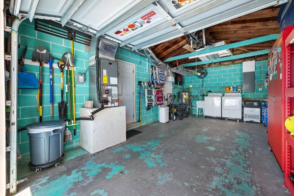 1472 DURLING DRIVE S, South Pasadena, FL 33707 An abundance of wall rack storage for your garden tools, beach chairs, ladders etc.
