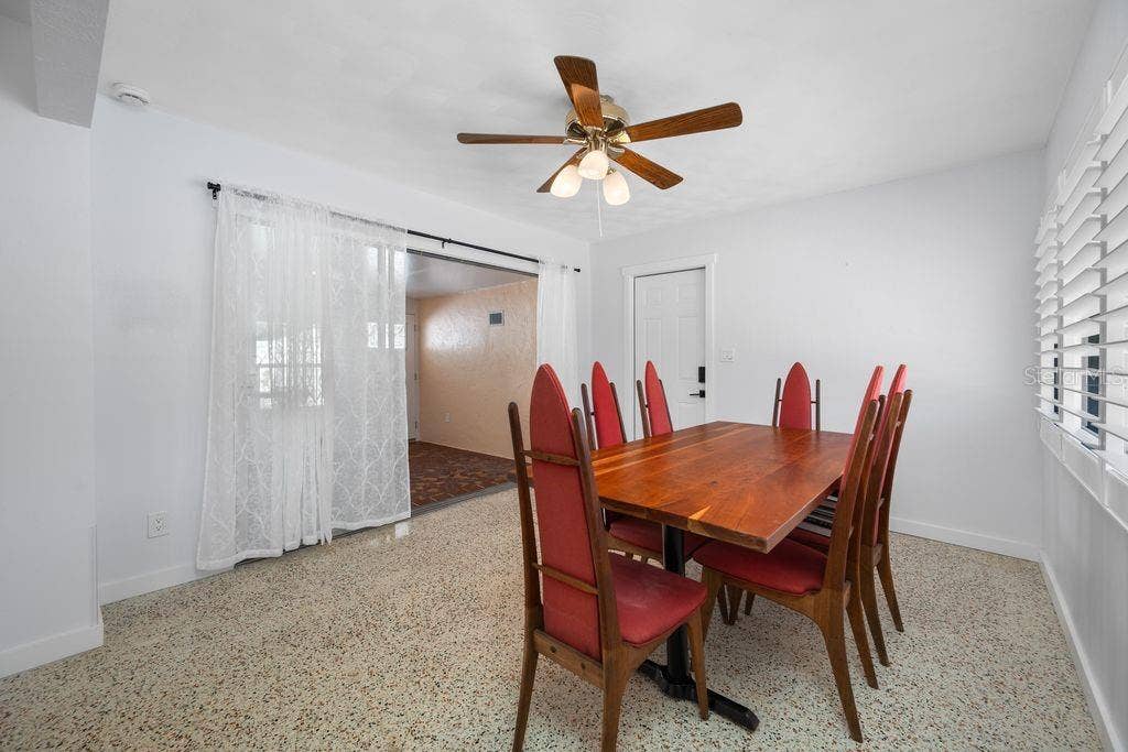 1472 DURLING DRIVE S, South Pasadena, FL 33707 Dining Room showing Entrance to Bonus Room and Pedestrian Door to Garage