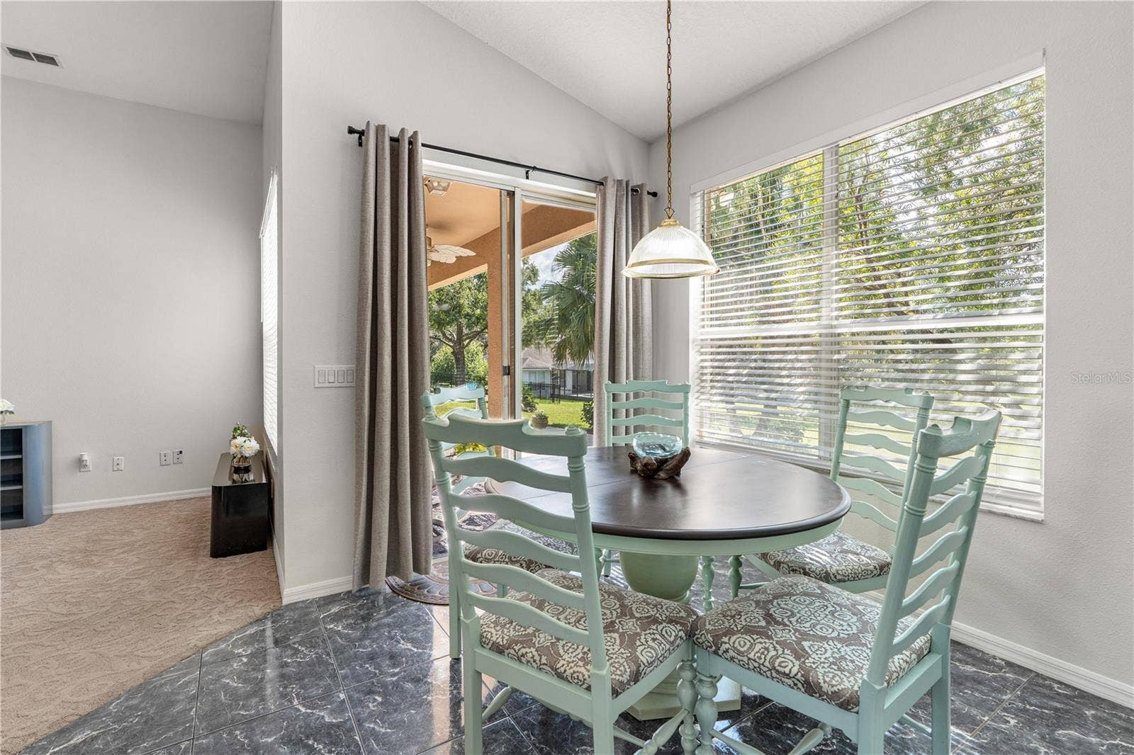 725 TIGRIS LANE, Lake Mary, FL 32746 Breakfast area with sliding glass doors that lead to the covered porch
