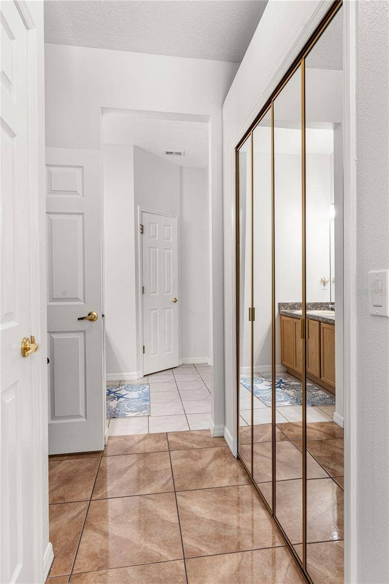 725 TIGRIS LANE, Lake Mary, FL 32746 Primary bedroom walk-in closet is in-between the bedroom and the bathroom