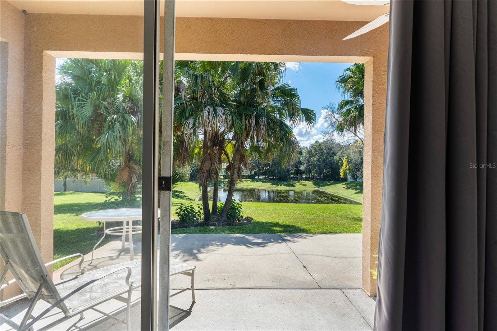725 TIGRIS LANE, Lake Mary, FL 32746 View from primary bedroom sliding glass doors