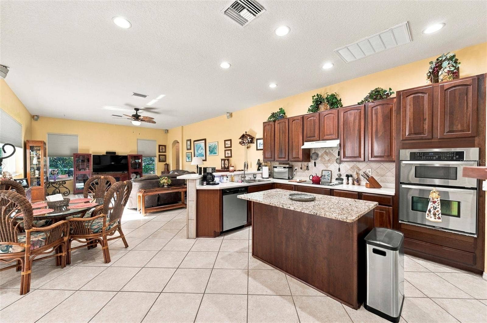 Open concept kitchen - stainless appliances with island