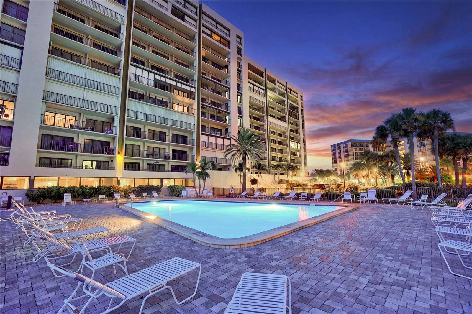1480 GULF BOULEVARD, #601, Clearwater Beach, FL 33767 heated beachfront pool at sunset