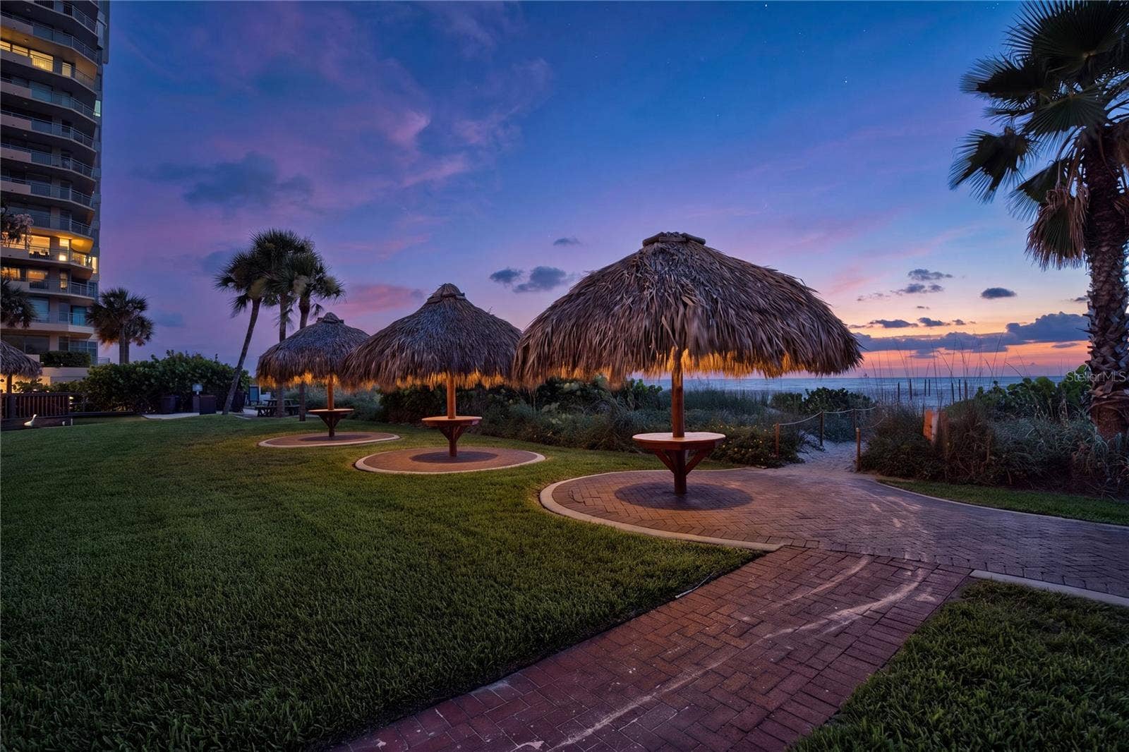1480 GULF BOULEVARD, #601, Clearwater Beach, FL 33767 beachfront tiki huts at sunset