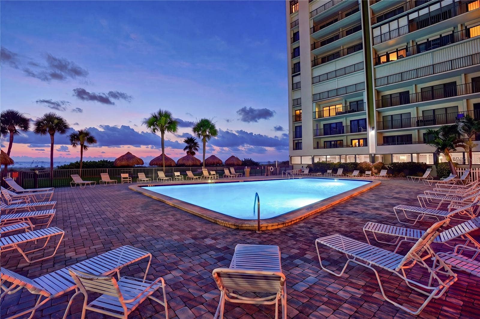 1480 GULF BOULEVARD, #601, Clearwater Beach, FL 33767 heated beachfront pool at sunset
