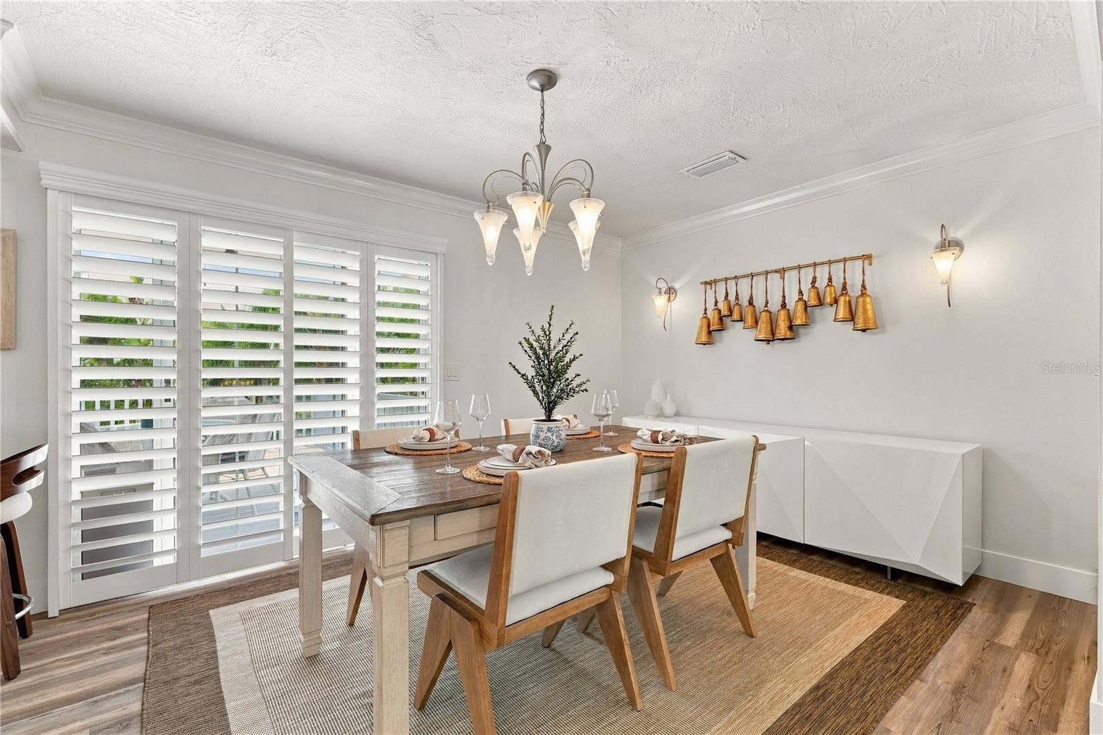 Dining room that opens to balcony and beautiful view of the pool.
