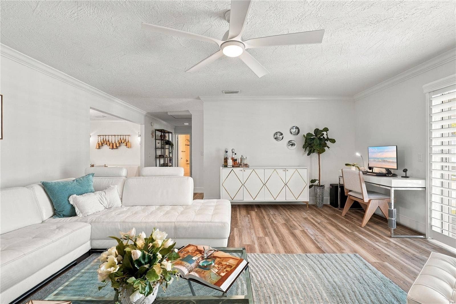 Spacious living room with view from the front porch.