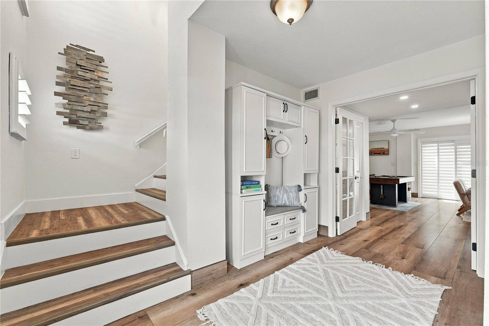 Spacious entryway connecting to bonus room and backyard.
