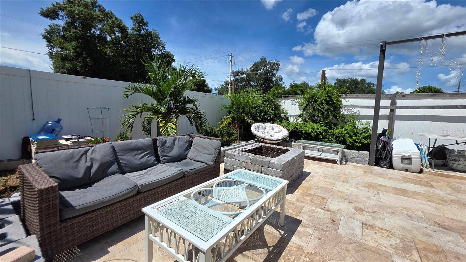 1702 26TH STREET W, Bradenton, FL 34205 Tiled backyard patio area, Vinyl Fence partition separated back portion of lot