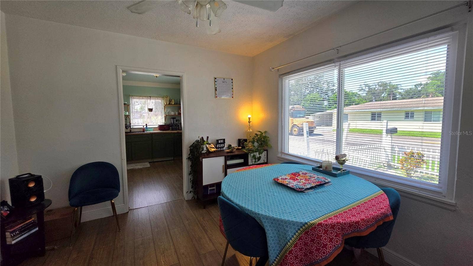 1702 26TH STREET W, Bradenton, FL 34205 Dining/Flex Room with Ceiling Fan, Laminate Flooring, and Windows overlooking Side Yard