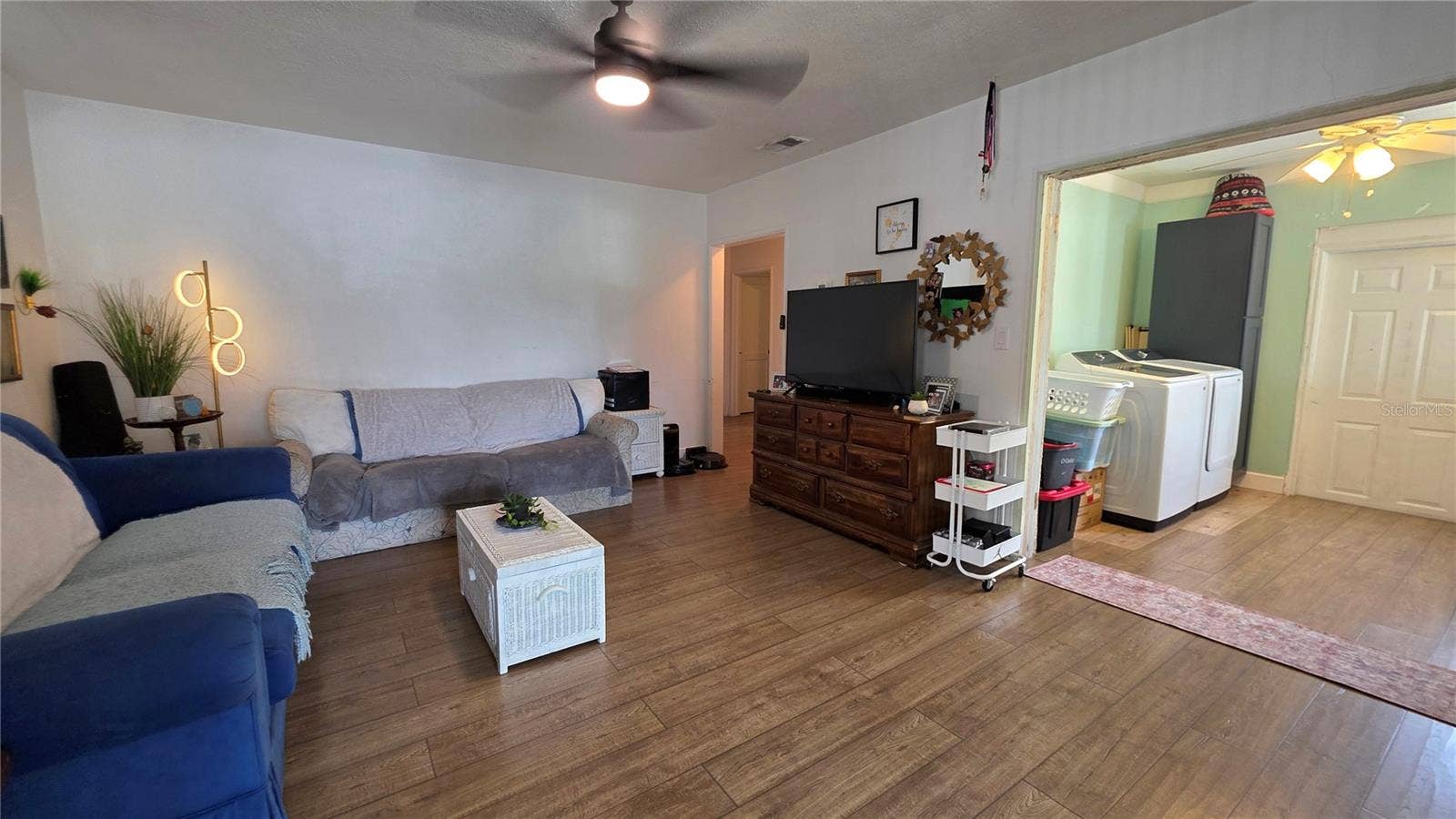 1702 26TH STREET W, Bradenton, FL 34205 Living Room adjacent to Inside Laundry Area and Back Door