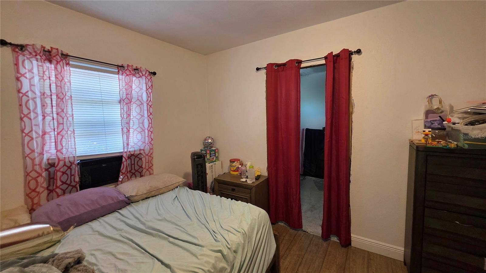 1702 26TH STREET W, Bradenton, FL 34205 Bedroom #2 with Laminate Flooring and Window to Side Yard View (Entry to En-Suite Bathroom Addition - will need to be removed)