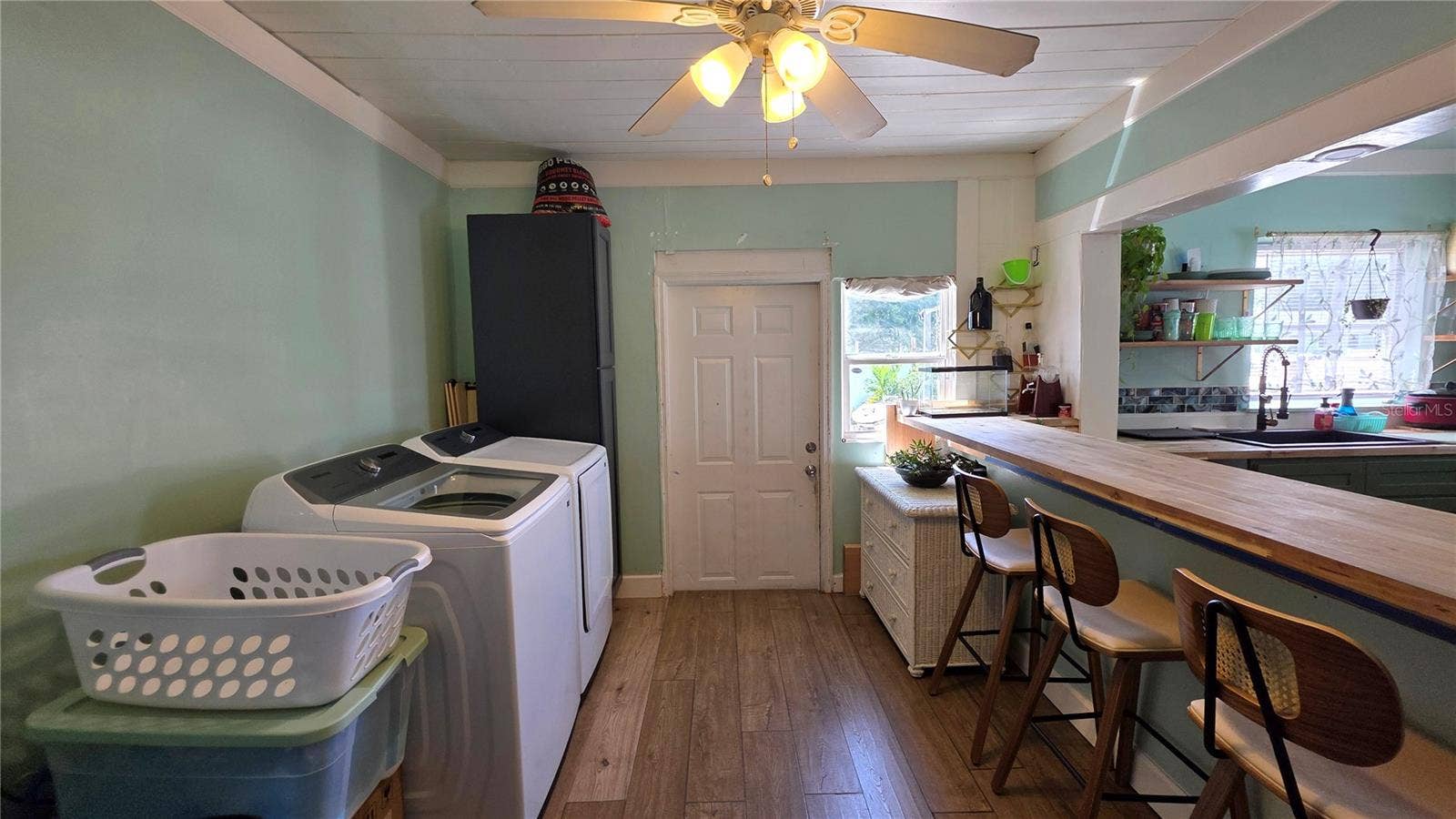 1702 26TH STREET W, Bradenton, FL 34205 Inside Laundry Area, Breakfast Bar and Seating, Back Door Entry