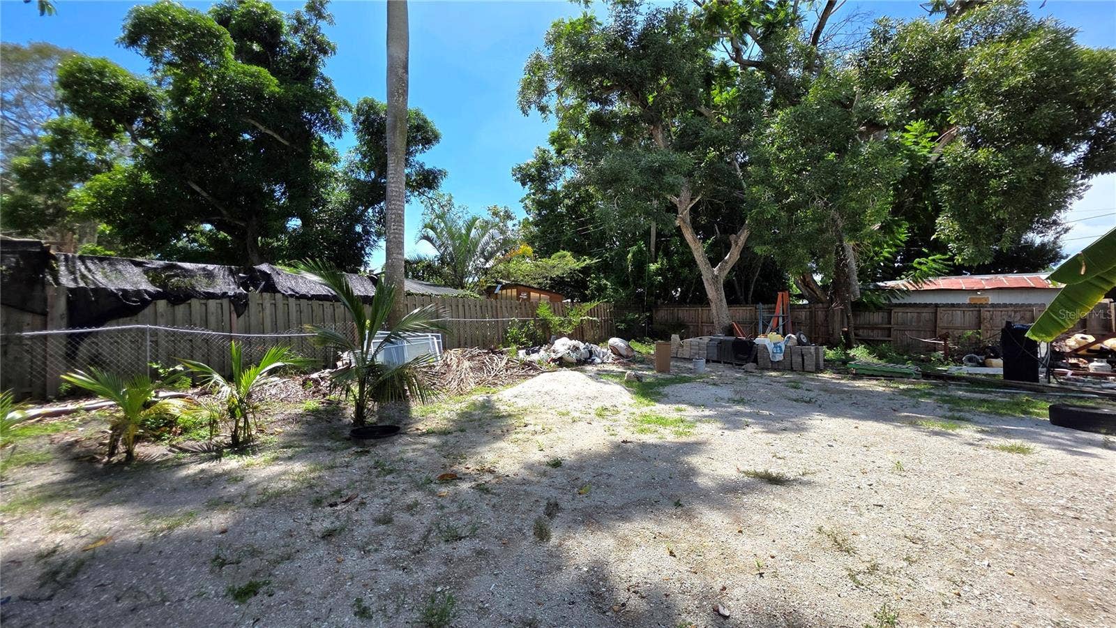 1702 26TH STREET W, Bradenton, FL 34205 Backyard, Oversized Lot, Fully Fenced, Side driveway with Gated Entry to Backyard, Smaller Driveway on Back of Lot