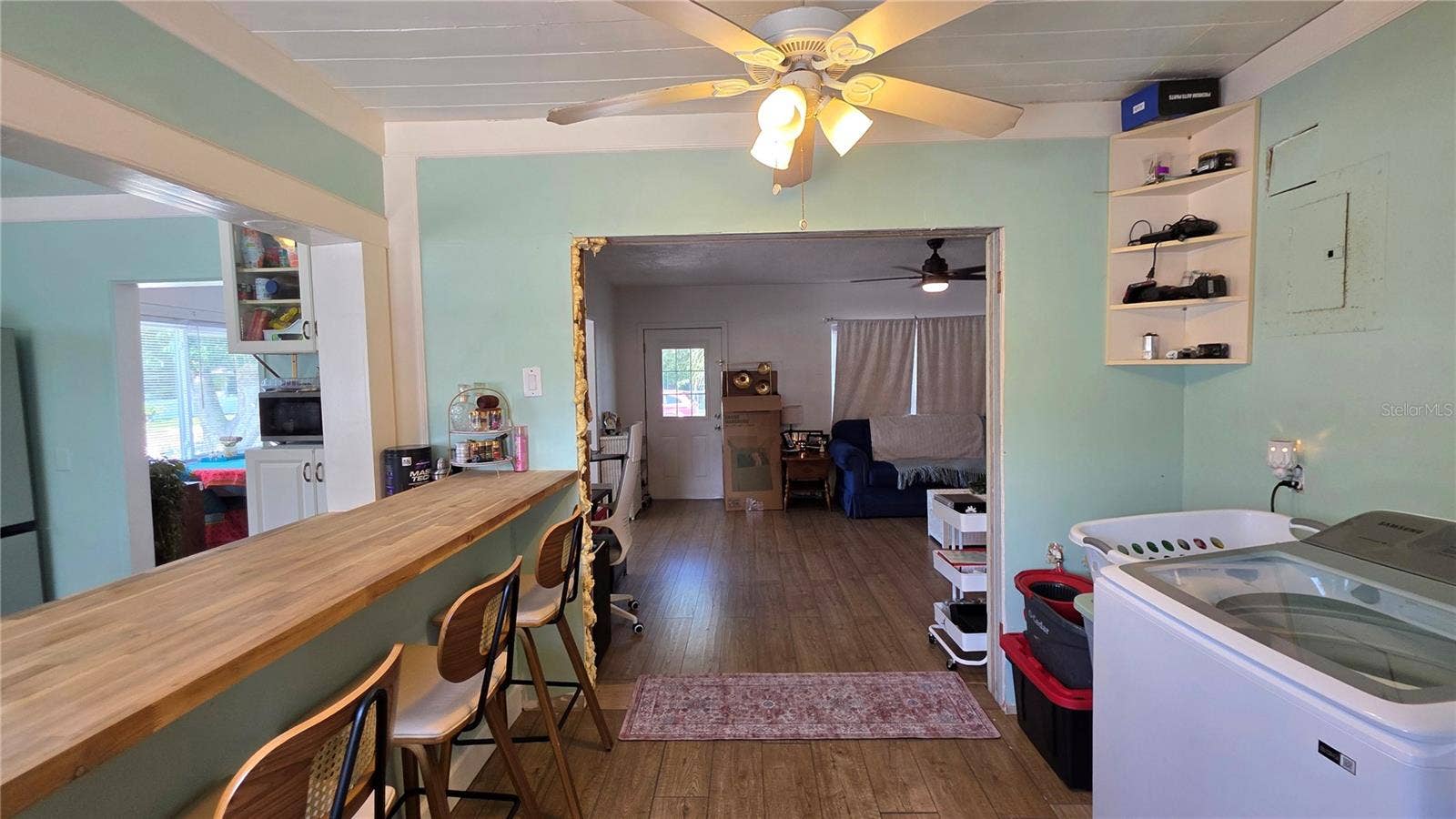 1702 26TH STREET W, Bradenton, FL 34205 Inside Laundry Area, Breakfast Bar & Seating, View to Living Room & Entry