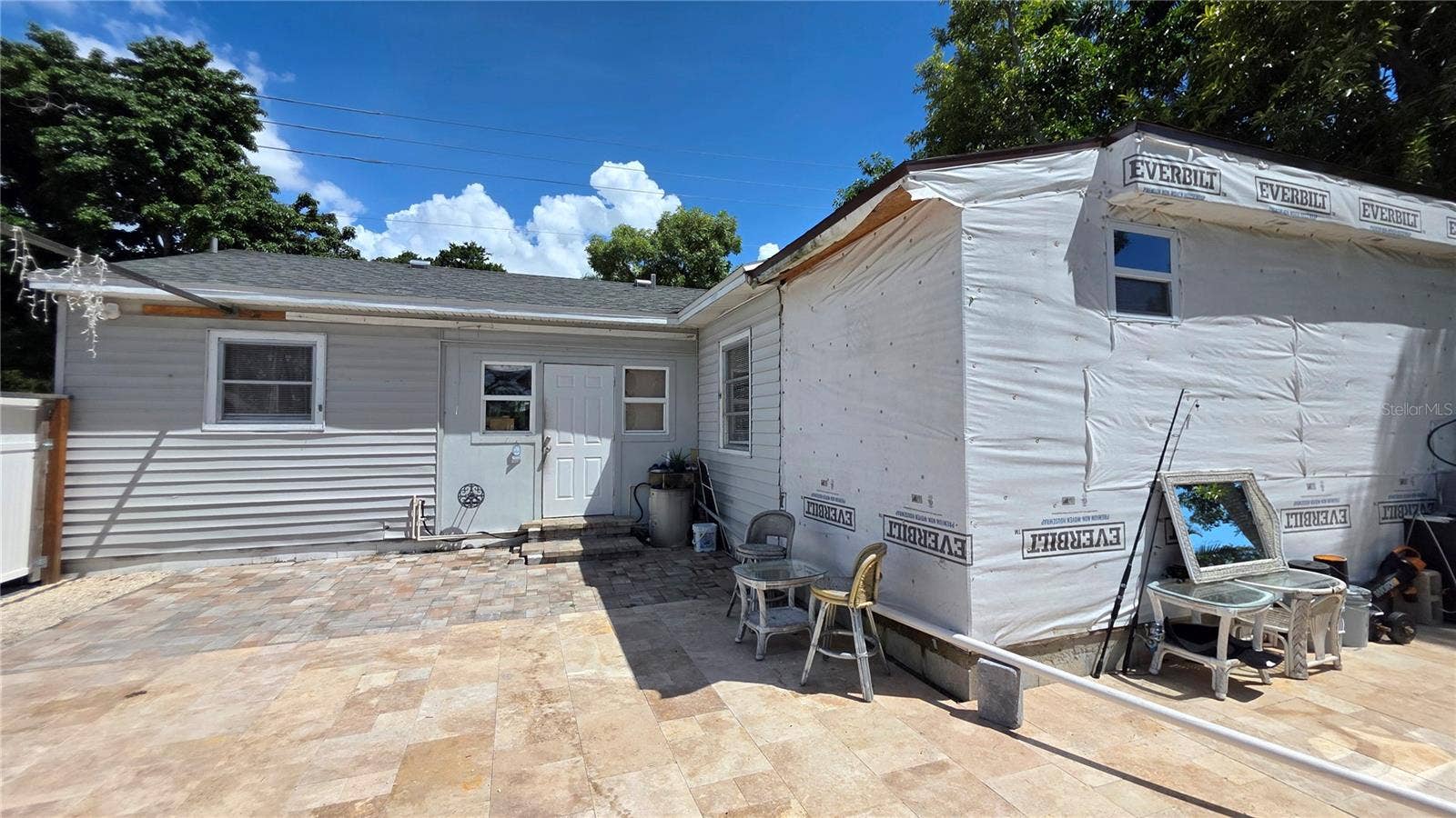1702 26TH STREET W, Bradenton, FL 34205 Back of Home and Back Door Entry. Temporary Addition started will need to be removed.