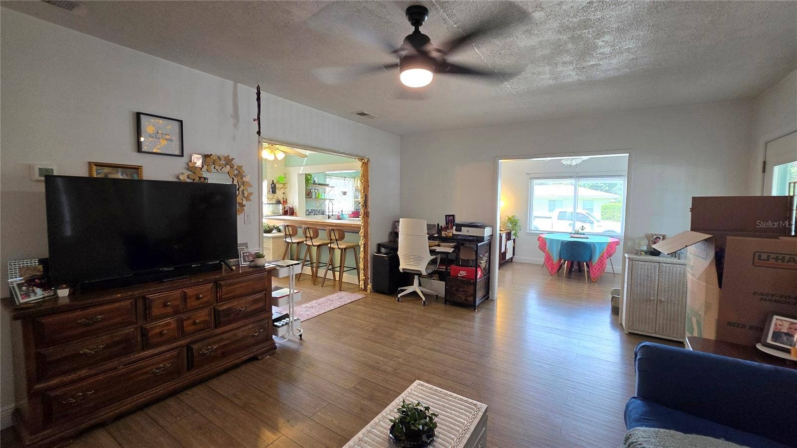 1702 26TH STREET W, Bradenton, FL 34205 Living Room adjacent to Dining/Flex Room and Inside Laundry Area