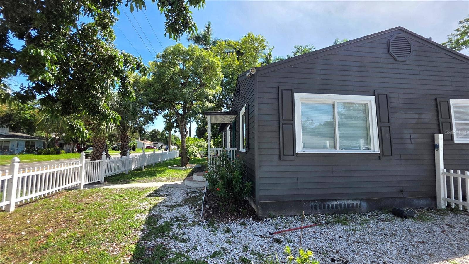 1702 26TH STREET W, Bradenton, FL 34205 Side of Home, Side Yard, Fully Fenced