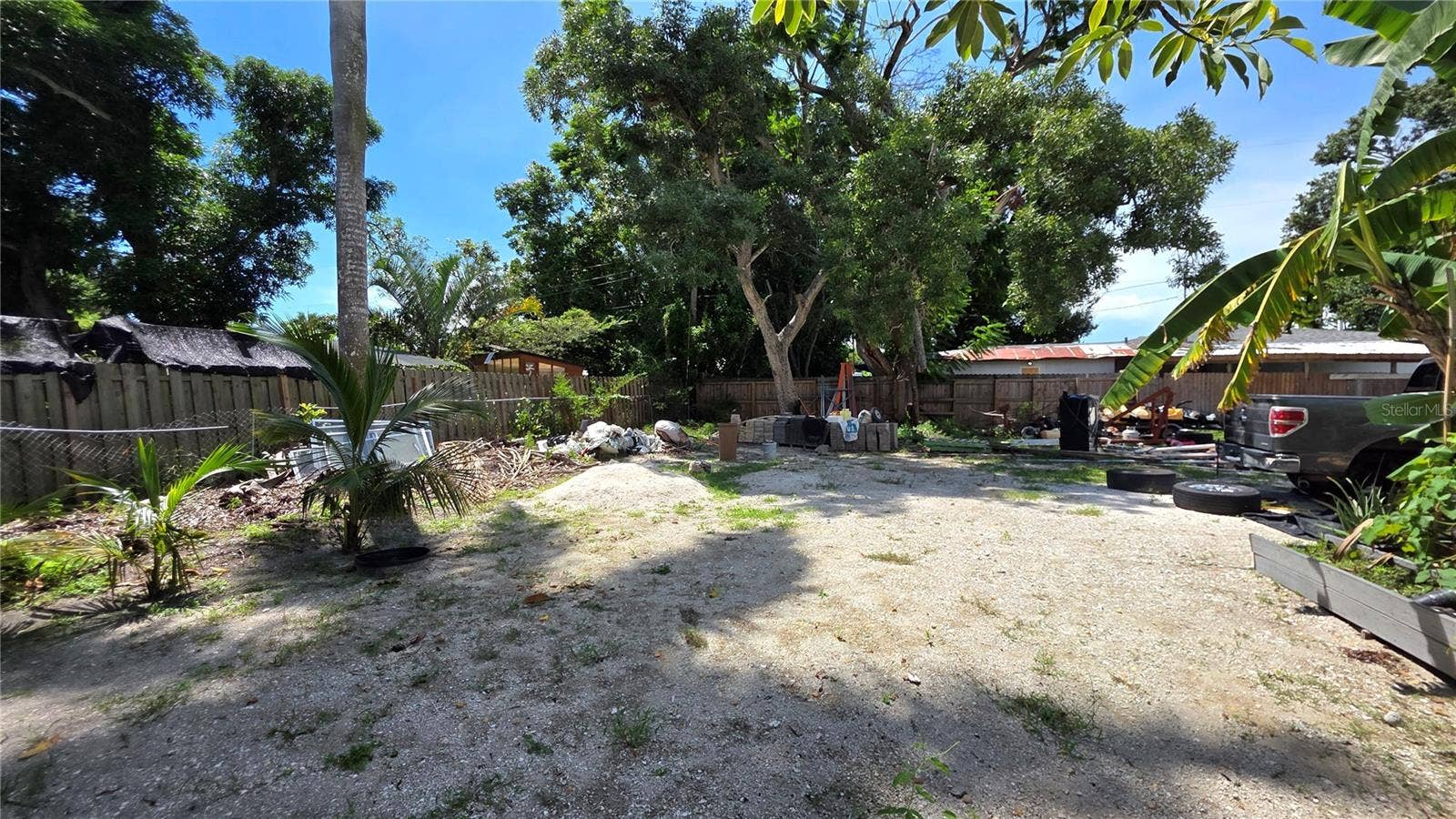 1702 26TH STREET W, Bradenton, FL 34205 Backyard, Oversized Lot, Fully Fenced, Side driveway with Gated Entry to Backyard, Smaller Driveway on Back of Lot