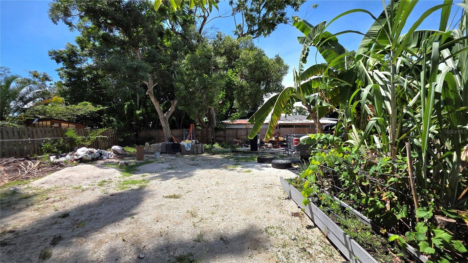 1702 26TH STREET W, Bradenton, FL 34205 Backyard, Oversized Lot, Fully Fenced, Side driveway with Gated Entry to Backyard, Smaller Driveway on Back of Lot
