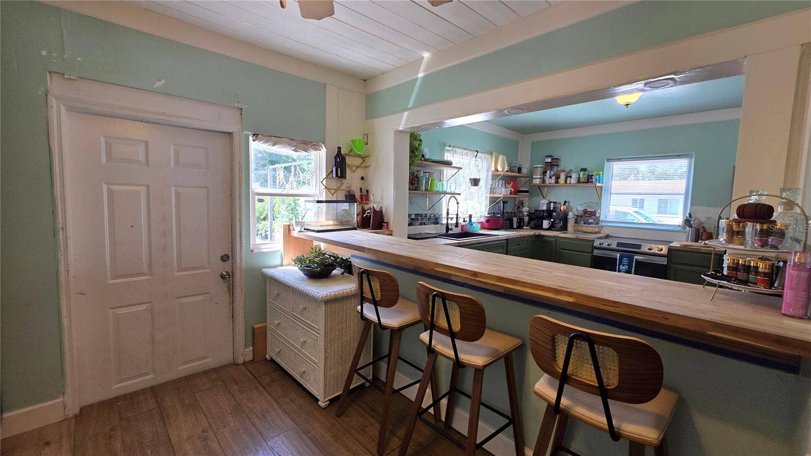 1702 26TH STREET W, Bradenton, FL 34205 Breakfast Bar and Seating overlooking Kitchen, Back Door Entry