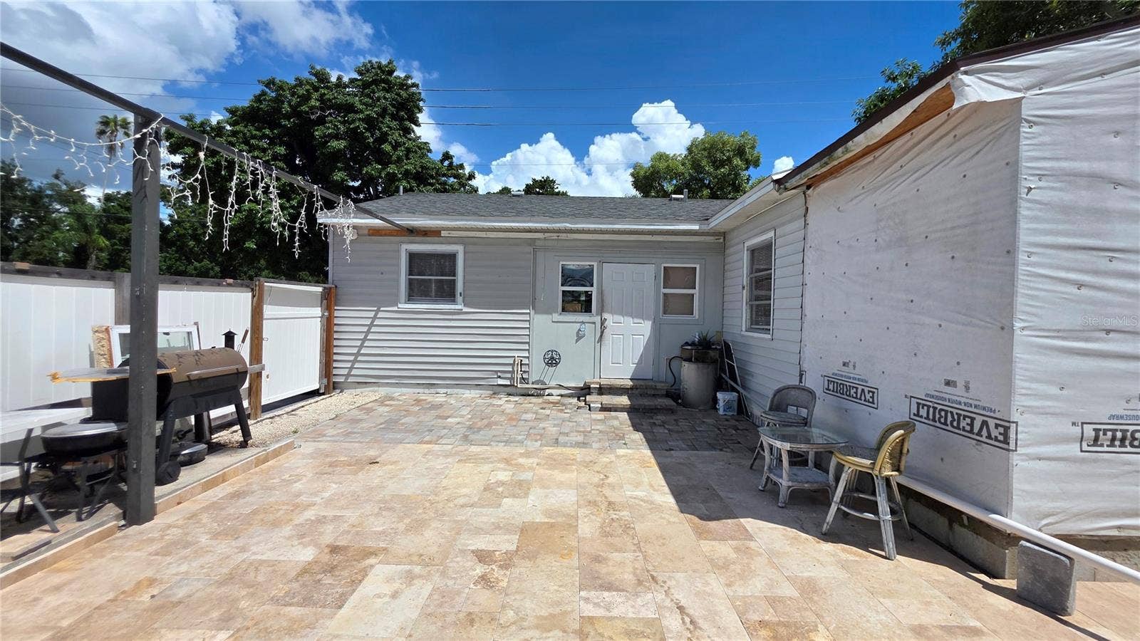 1702 26TH STREET W, Bradenton, FL 34205 Back of Home, and Back Door Entry to Home. Addition partially added will need to be removed.
