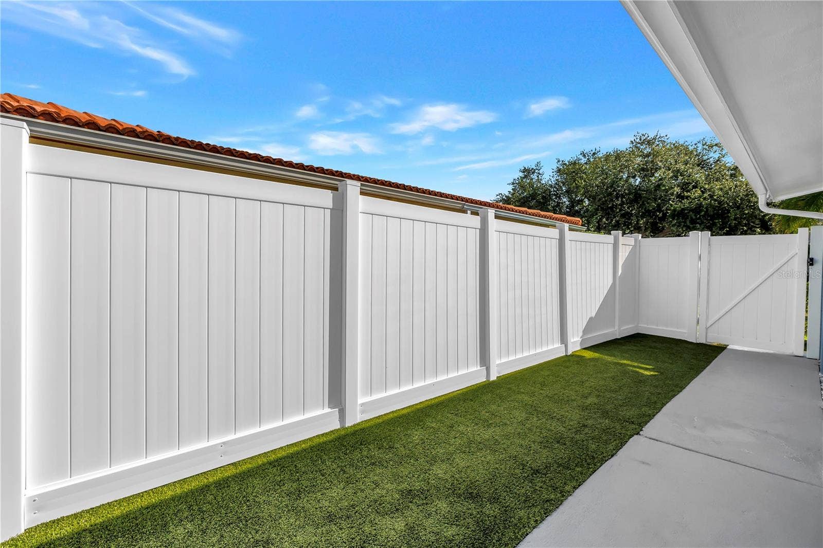 1114 2ND AVENUE S, Tierra Verde, FL 33715 Astro turf is pet friendly and easy to hose and maintain.