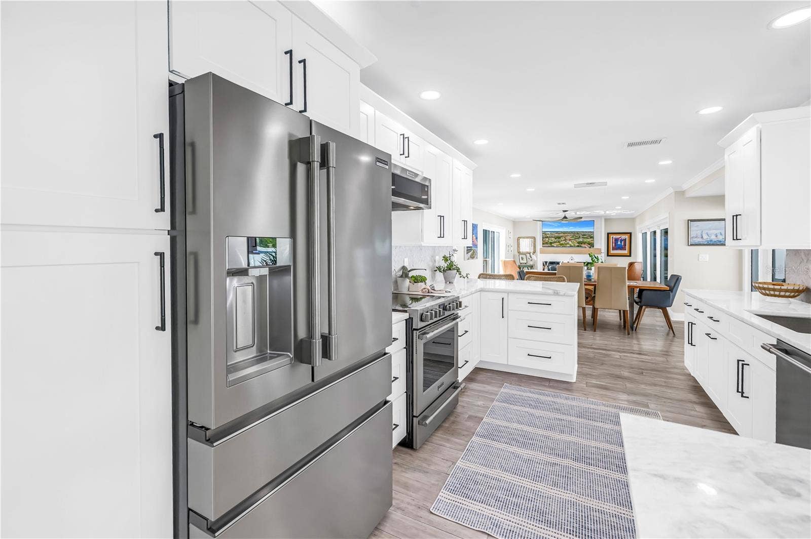 1114 2ND AVENUE S, Tierra Verde, FL 33715 Stainless steel French style three drawer refrigerator and lots of panty space.