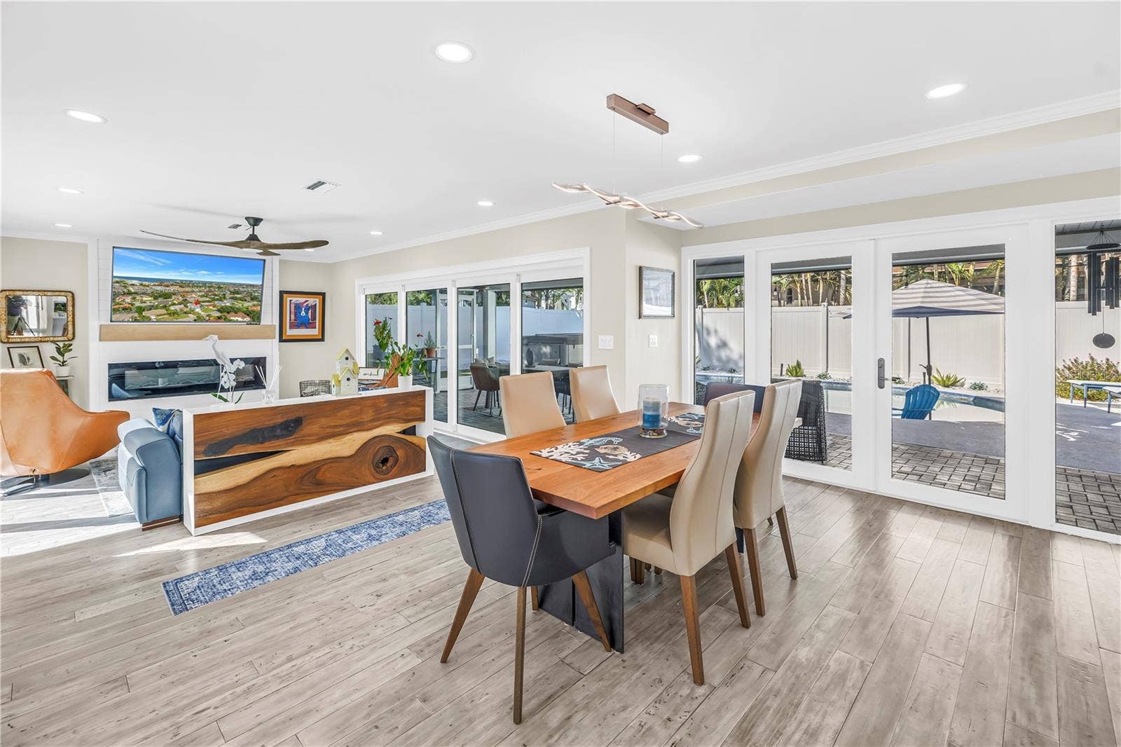 1114 2ND AVENUE S, Tierra Verde, FL 33715 Dining room opens into lanai through French Doors.