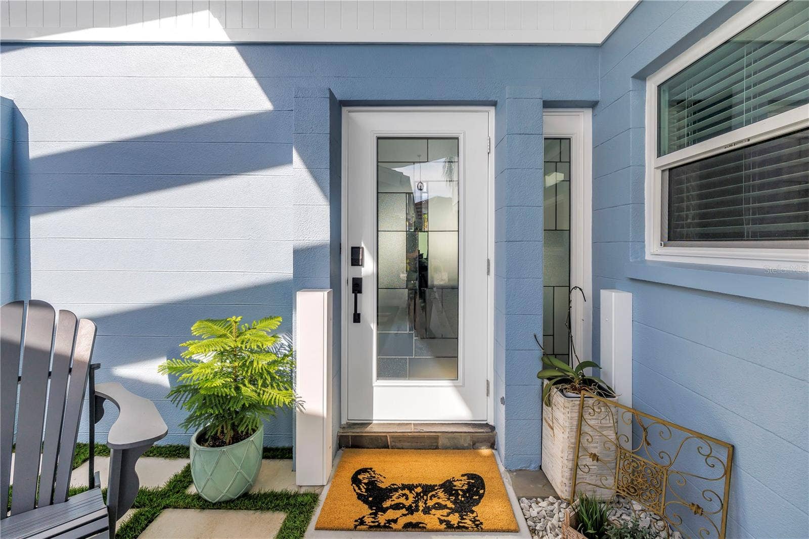 1114 2ND AVENUE S, Tierra Verde, FL 33715 Fido says welcome home! Custom front door with inlaid glass and glass side panel.