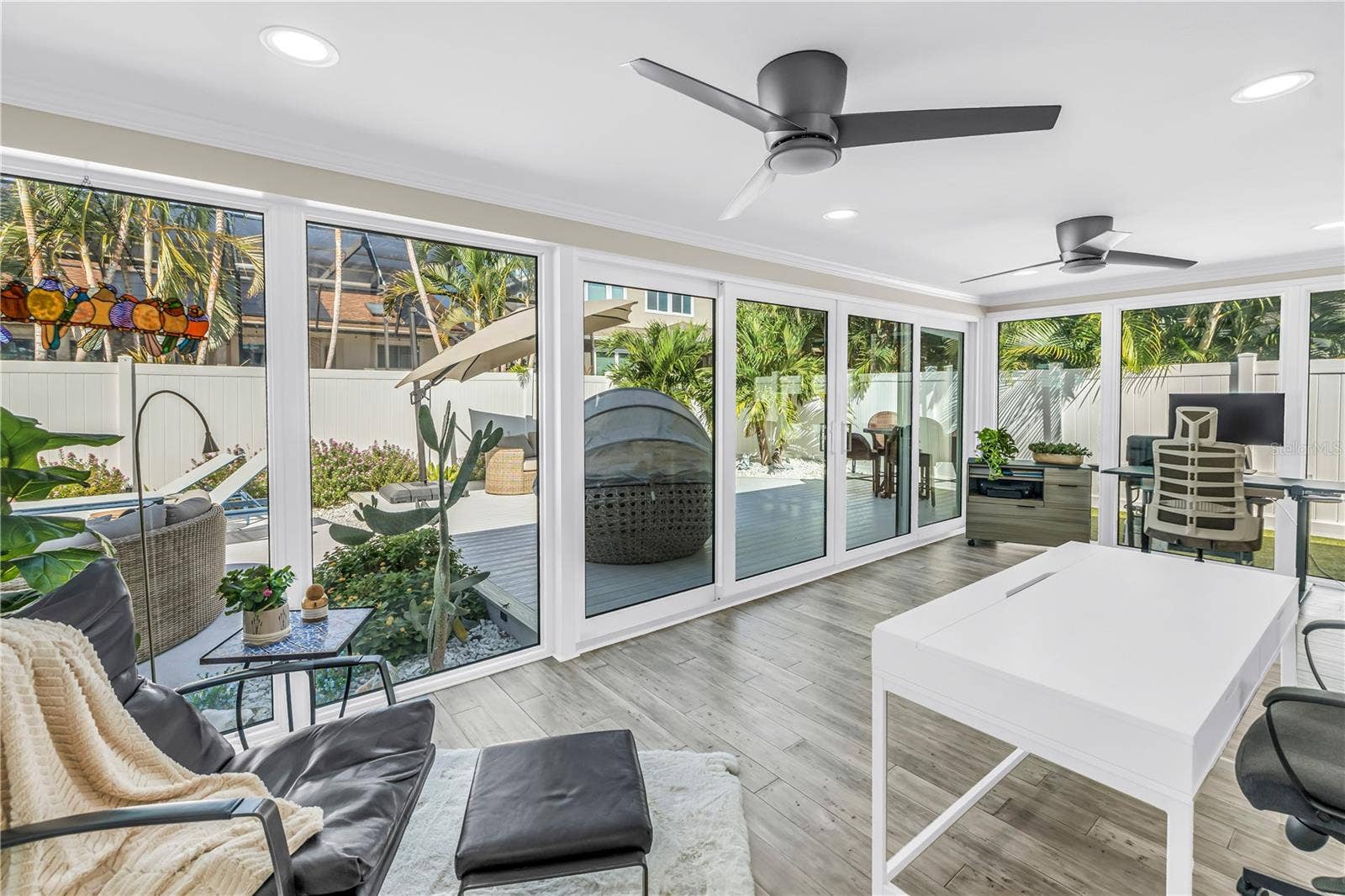 1114 2ND AVENUE S, Tierra Verde, FL 33715 Beautiful light filled living space surrounded by impact rated double sliders.