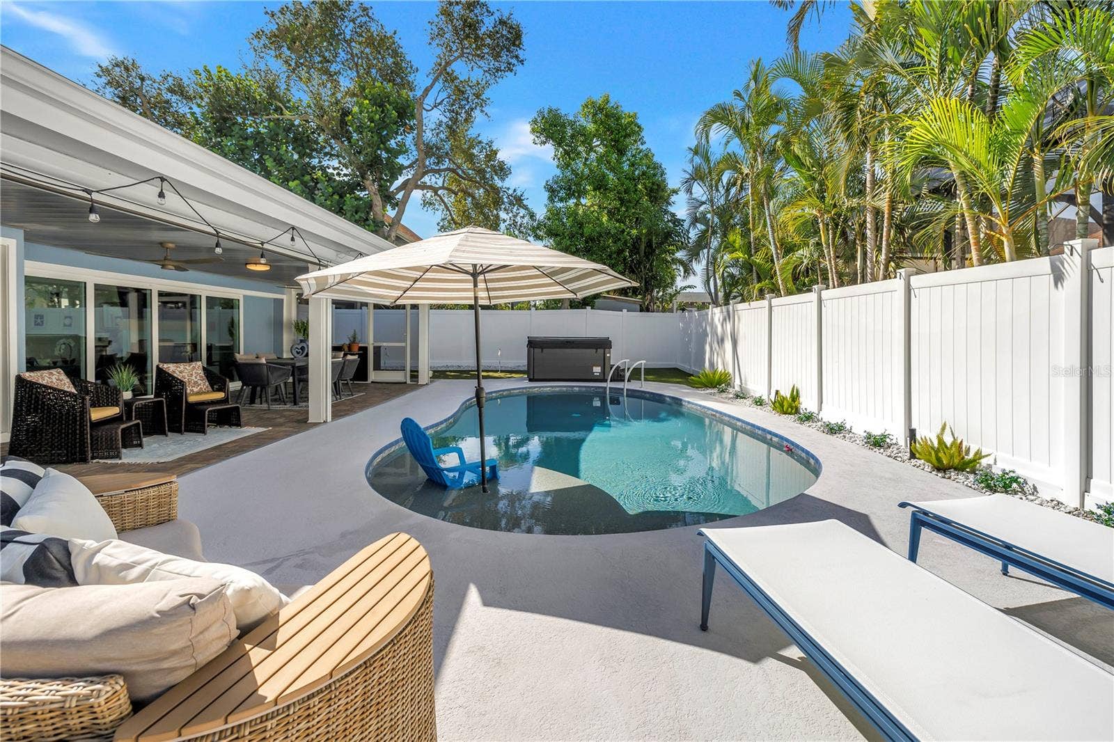 1114 2ND AVENUE S, Tierra Verde, FL 33715 Heated AND Chilled six feet deep saltwater pool with sun shelf and umbrella option.