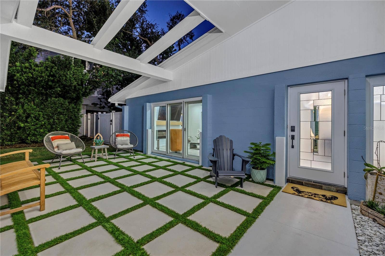 1114 2ND AVENUE S, Tierra Verde, FL 33715 24 x 24 block pavers accented with astro turf.