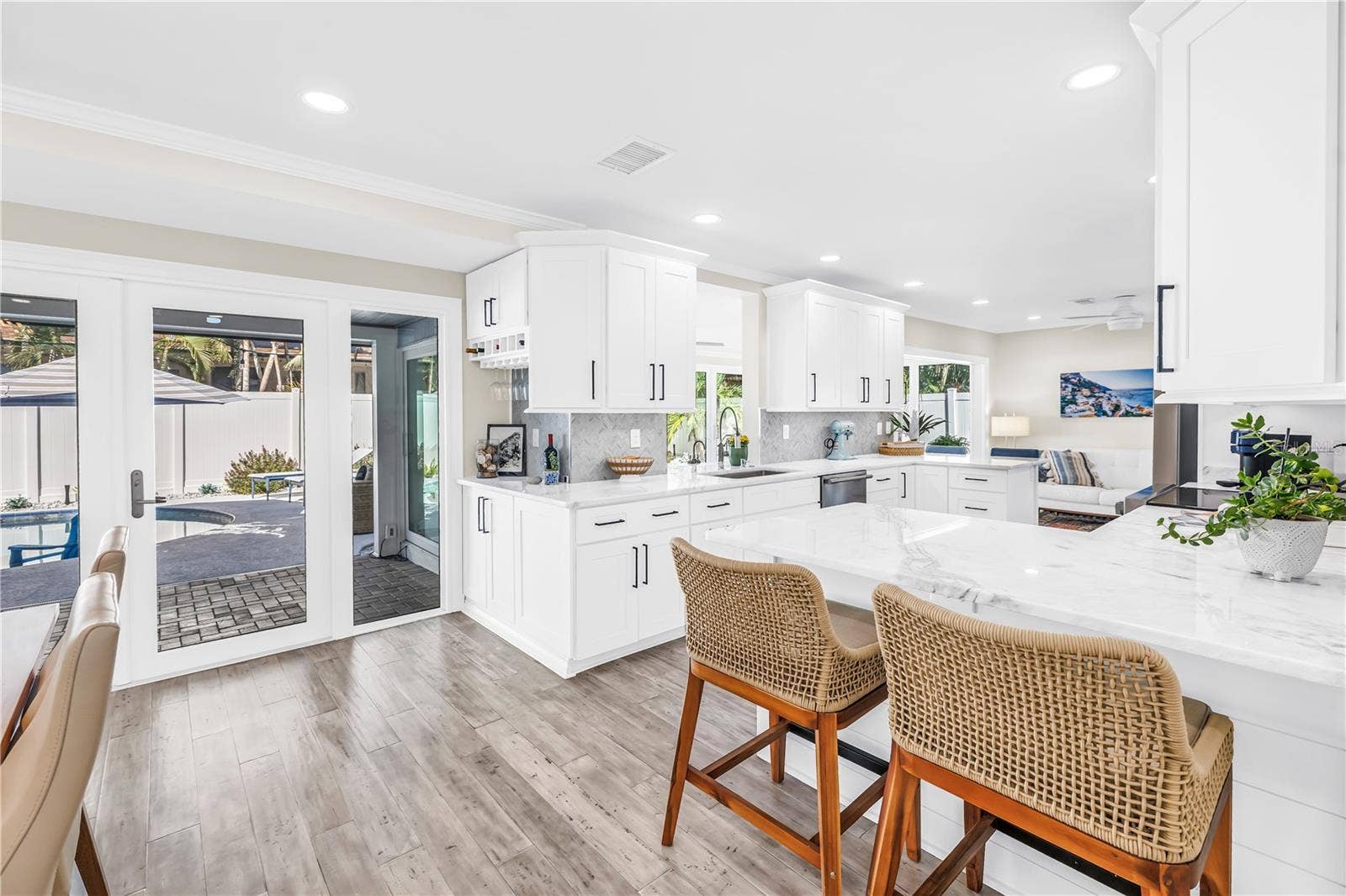 1114 2ND AVENUE S, Tierra Verde, FL 33715 Casual seating to "help" the cook in this Showstopper Kitchen! Quartz countertops have a very light blue hue!
