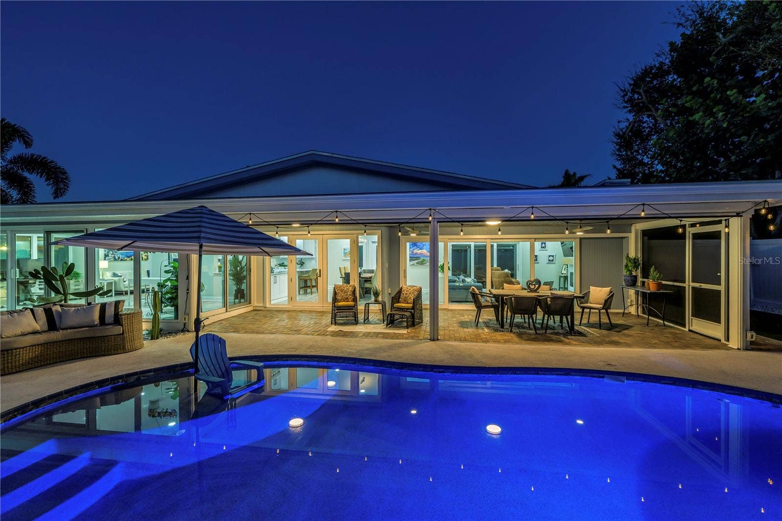1114 2ND AVENUE S, Tierra Verde, FL 33715 I love the glow of the Edison Lights that reflect in the pool.