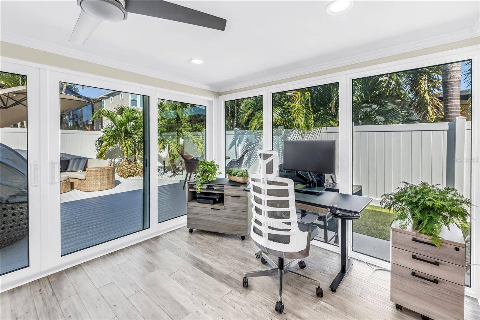 1114 2ND AVENUE S, Tierra Verde, FL 33715 Surround yourself with views of the open outdoor and pool areas.