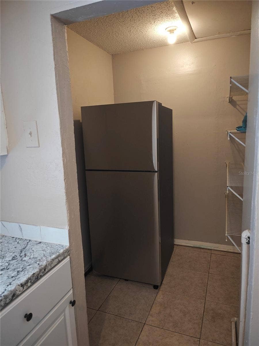 Side B Refrigerator placed inside open pantry