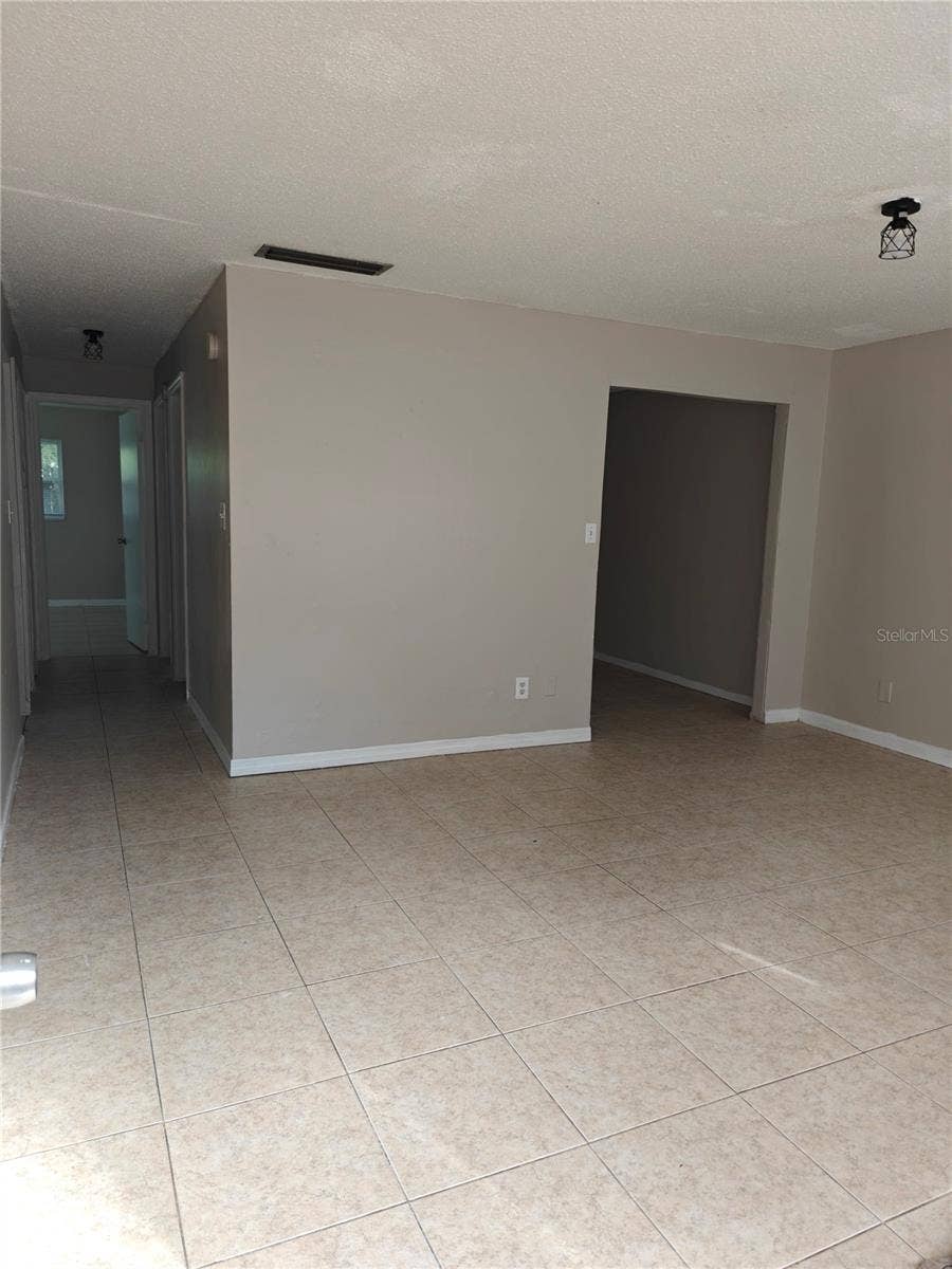 Side B Living room, small doorway to right is the den/office